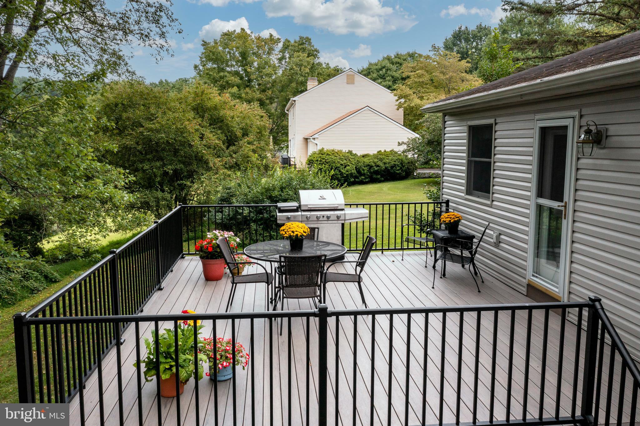 609 Spring Line Drive West Chester, PA 19382 - Photo 30 of 38 Updated composite deck overlooks tranquil grounds.
