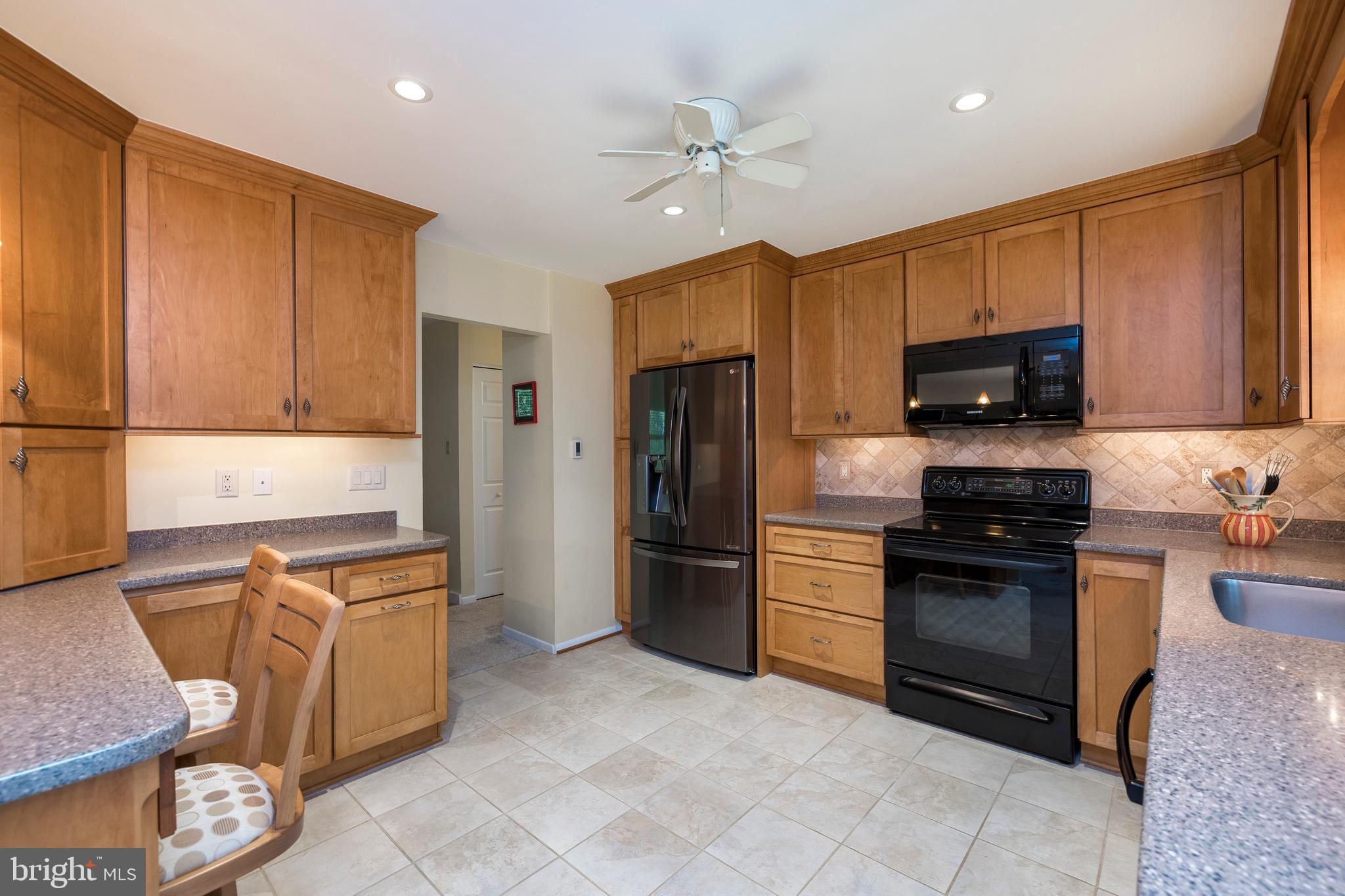 609 Spring Line Drive West Chester, PA 19382 - Photo 10 of 38 Updated kitchen w/custom tumbled stone backsplash!