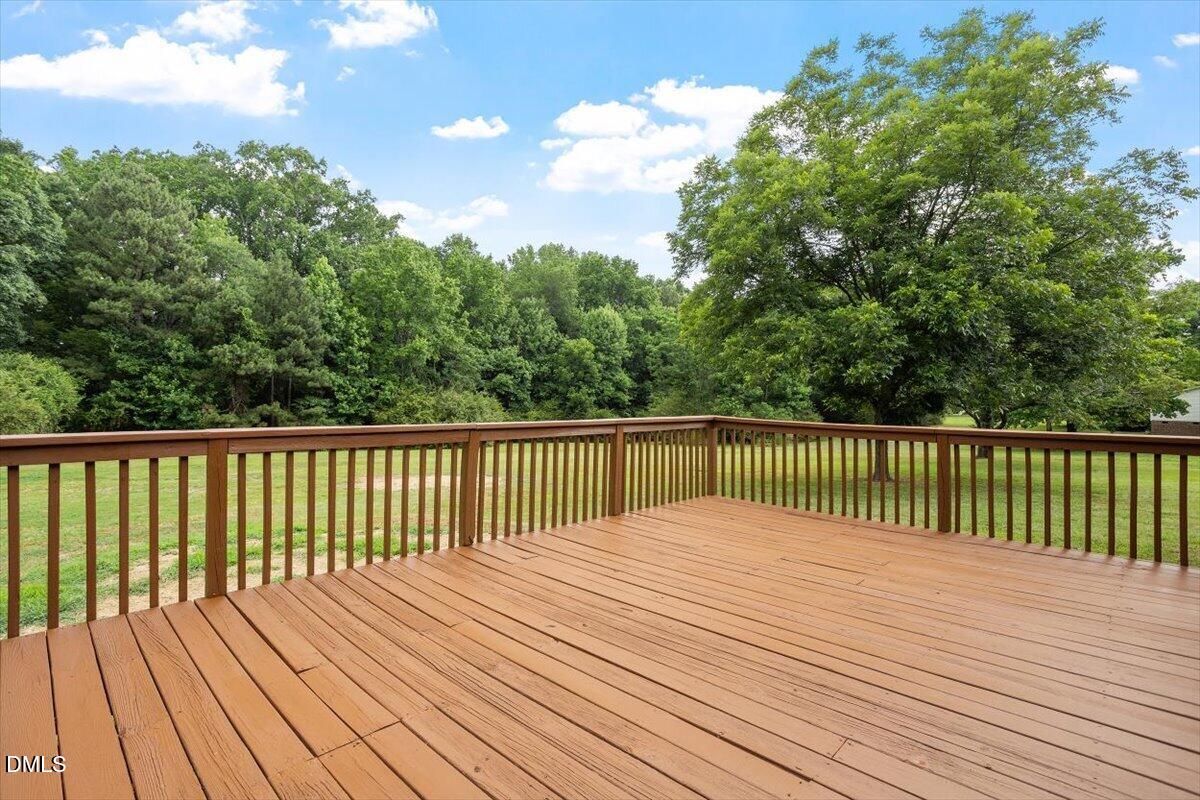 805 Rand Road Garner, NC 27529 - Photo 13 of 38 a balcony with trees in front of it