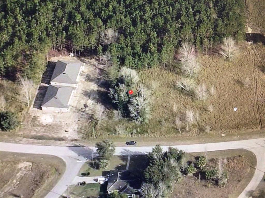 0 Poplar Road Ocala, FL 34480 - Photo 1 of 4 a view of a yard with wooden fence