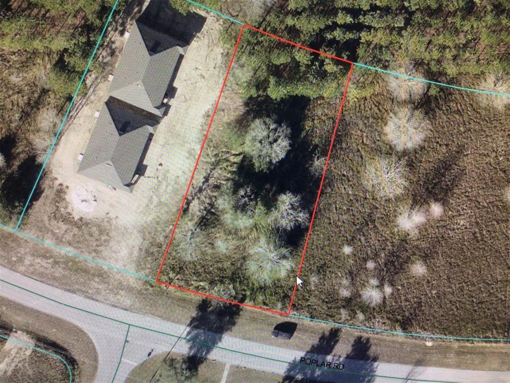 0 Poplar Road Ocala, FL 34480 - Photo 4 of 4 an aerial view of a house with a yard