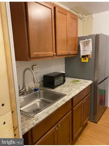 a kitchen with a refrigerator and cabinets