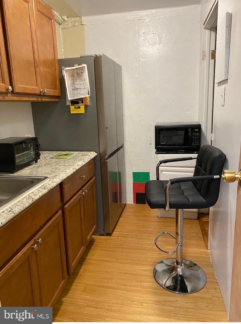 2943 Shepperton Terrace Silver Spring, MD 20904 - Photo 13 of 15 a kitchen with a sink cabinets and appliances