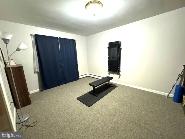 a white toilet sitting next to a bathroom sink and a shower