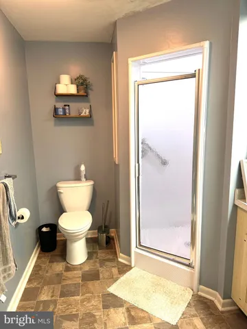 a view of a field with trees in front of it