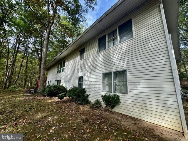 a front view of a house with yard