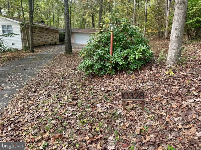 a view of a workspace with furniture and wooden floor