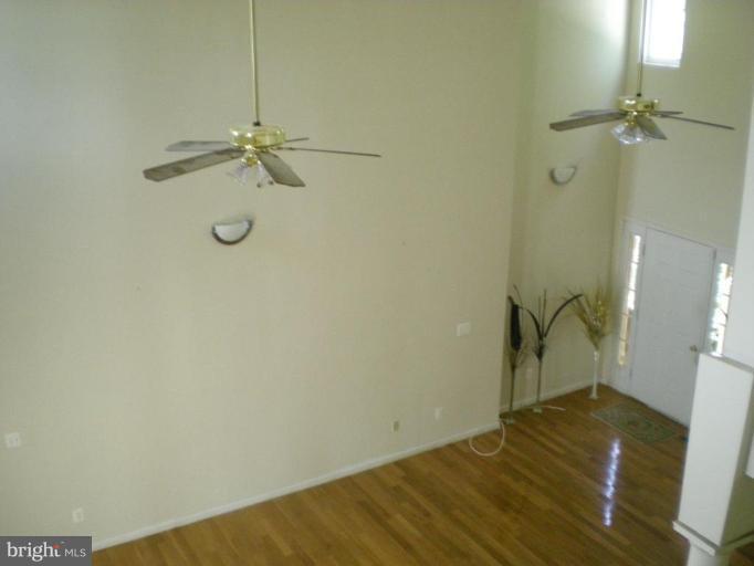 2205 Cool Spring Road Adelphi, MD 20783 - Photo 6 of 9 a view of a room with empty space and wooden floor