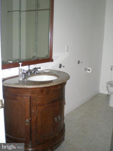 2205 Cool Spring Road Adelphi, MD 20783 - Photo 8 of 9 a bathroom with a sink and a mirror