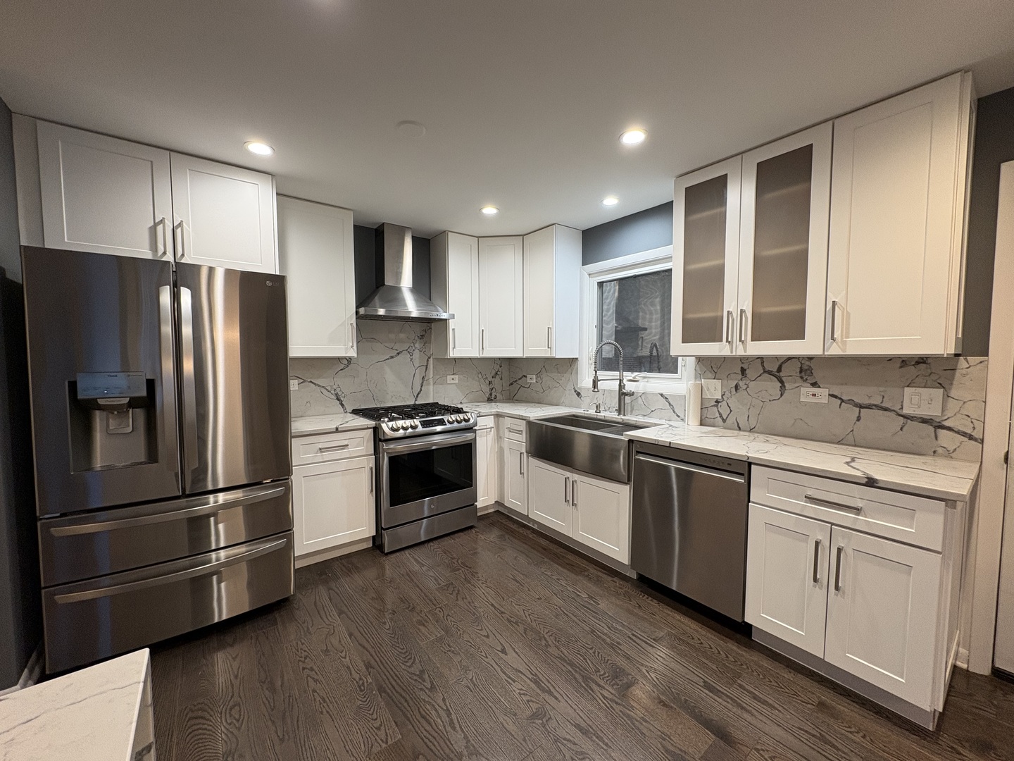 1100 Potter Road Park Ridge, IL 60068 - Photo 16 of 38 a kitchen with granite countertop white cabinets and stainless steel appliances