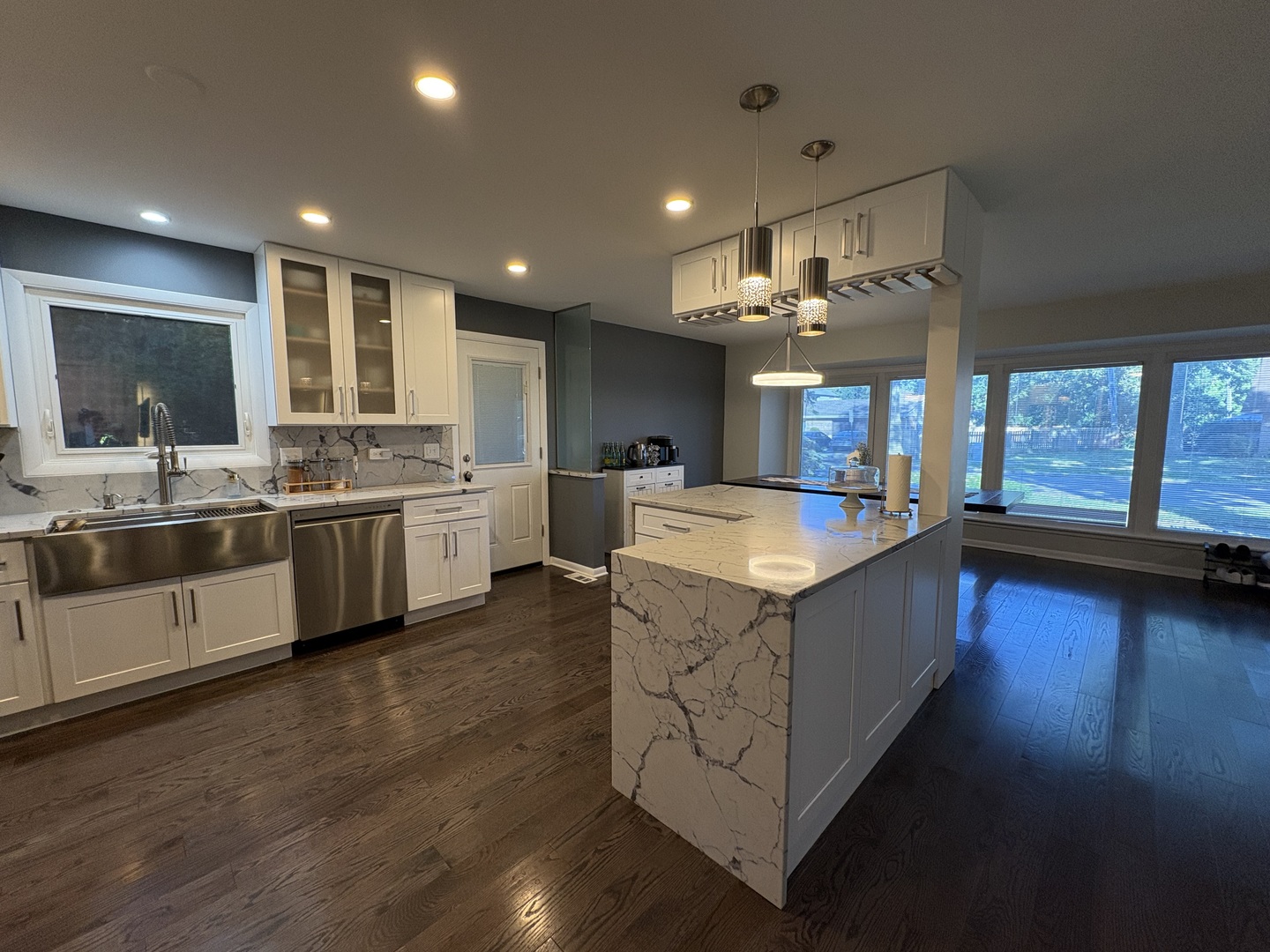 1100 Potter Road Park Ridge, IL 60068 - Photo 18 of 49 a large kitchen with stainless steel appliances kitchen island a large counter top a sink a stove and a refrigerator