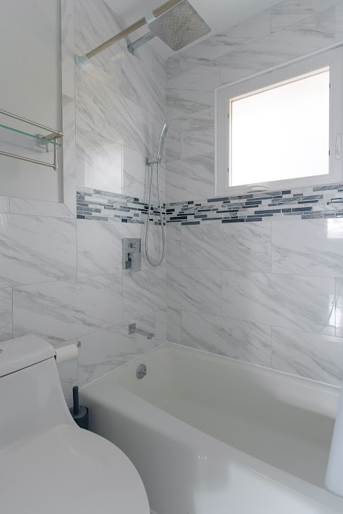 1100 Potter Road Park Ridge, IL 60068 - Photo 20 of 38 a bathroom with a granite countertop sink and a bathtub