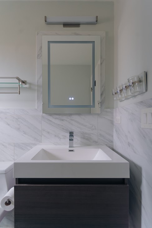 1100 Potter Road Park Ridge, IL 60068 - Photo 29 of 38 a bathroom with a sink and a mirror