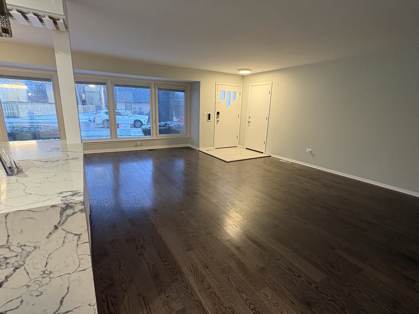 1100 Potter Road Park Ridge, IL 60068 - Photo 3 of 49 an empty room with wooden floor and windows