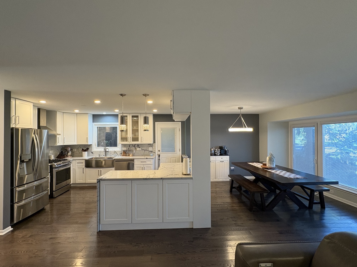 1100 Potter Road Park Ridge, IL 60068 - Photo 6 of 38 a view of a kitchen with dining table stainless steel appliances and wooden floor