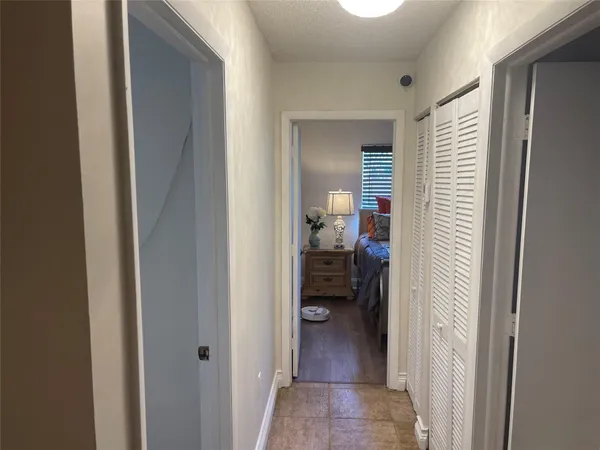 a view of a bathroom from a hallway