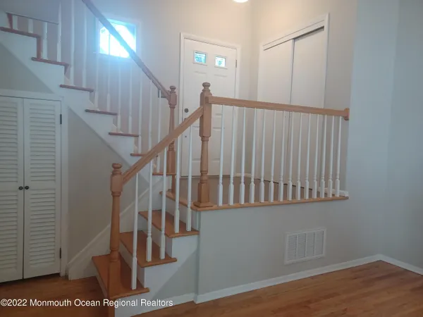 a view of entryway with wooden floor