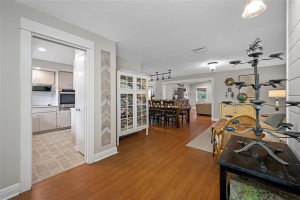 a spacious bathroom with a double vanity sink a mirror and a shower