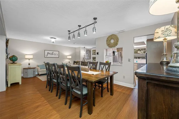 a view of a dining room with furniture and wooden floor