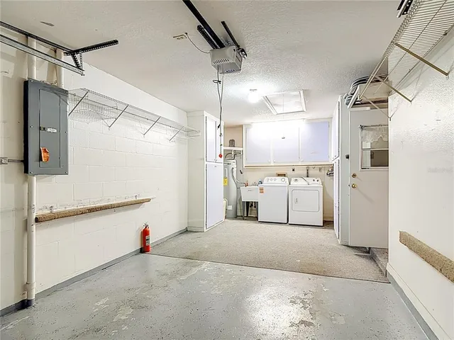 a kitchen with cabinets and a refrigerator
