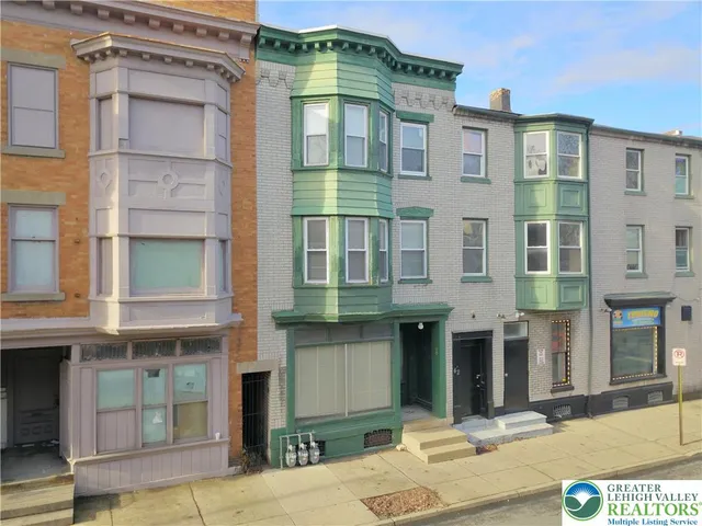 a front view of a multi story residential apartment building