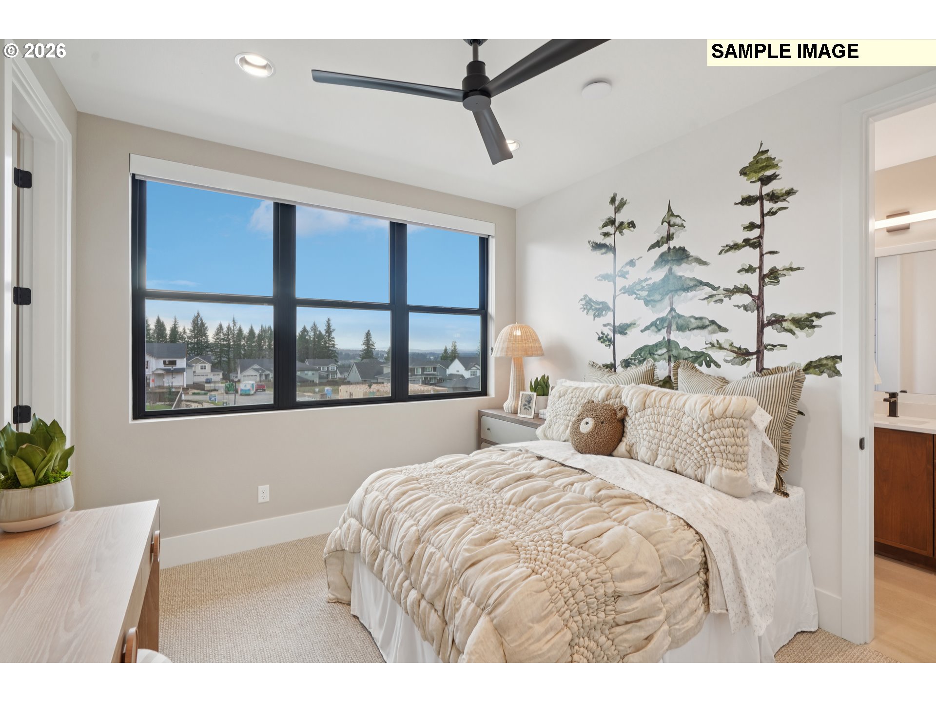 5244 North 94th Avenue Camas, WA 98607 - Photo 13 of 15 a bedroom with a large bed and a chandelier