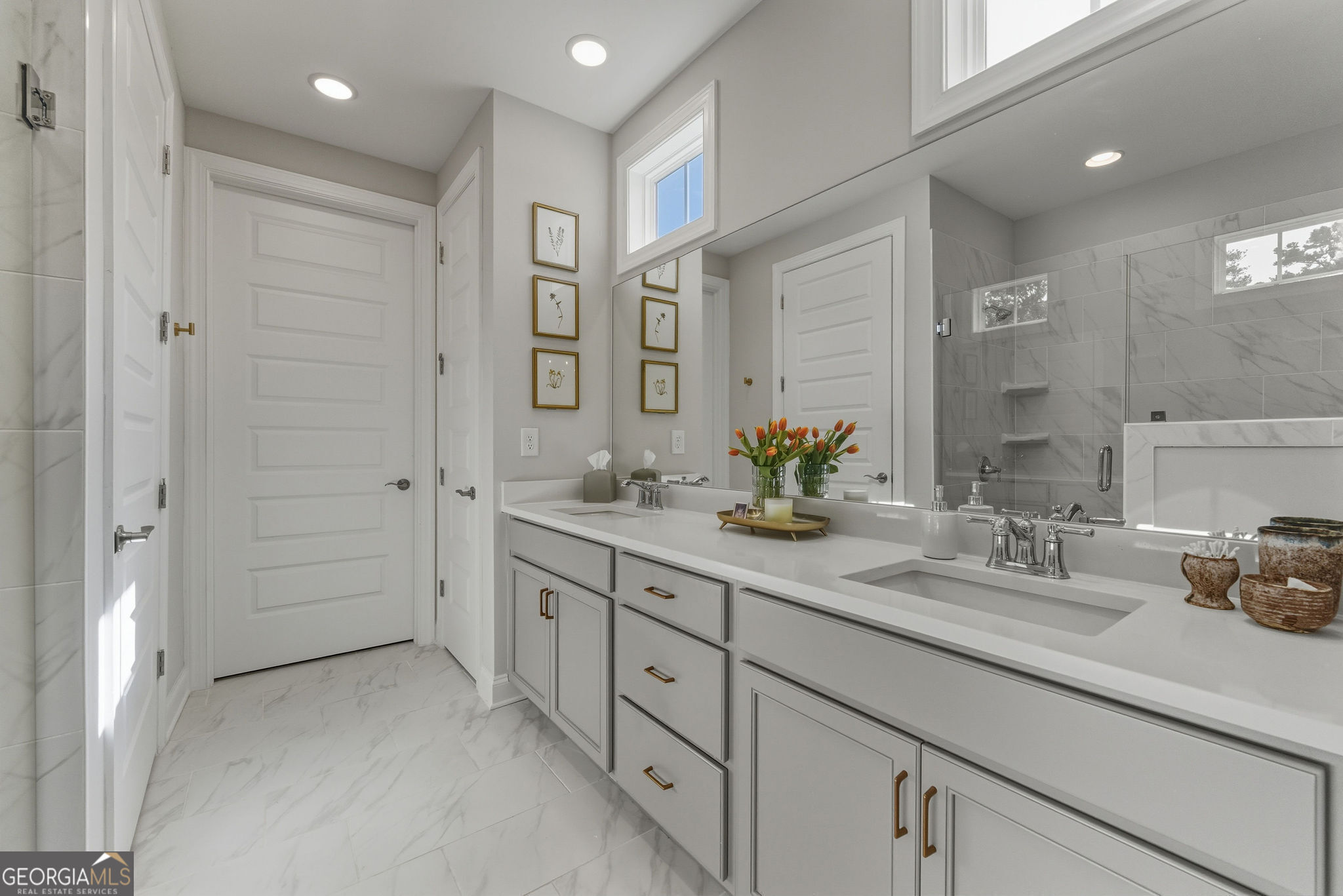 1140 Providence Loop Greensboro, GA 30642 - Photo 16 of 23 a bathroom with a double vanity sink mirror and shower