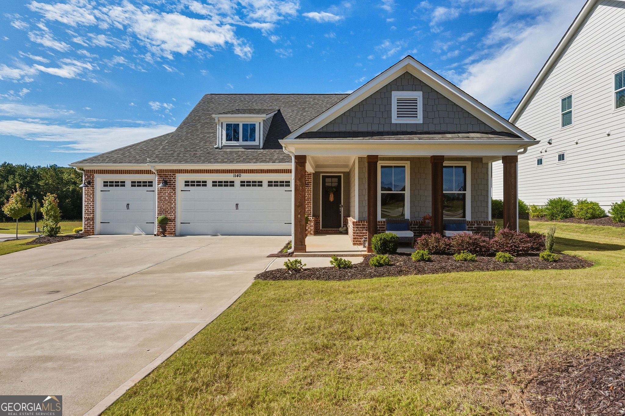 1140 Providence Loop Greensboro, GA 30642 - Photo 2 of 23 a front view of a house with a yard