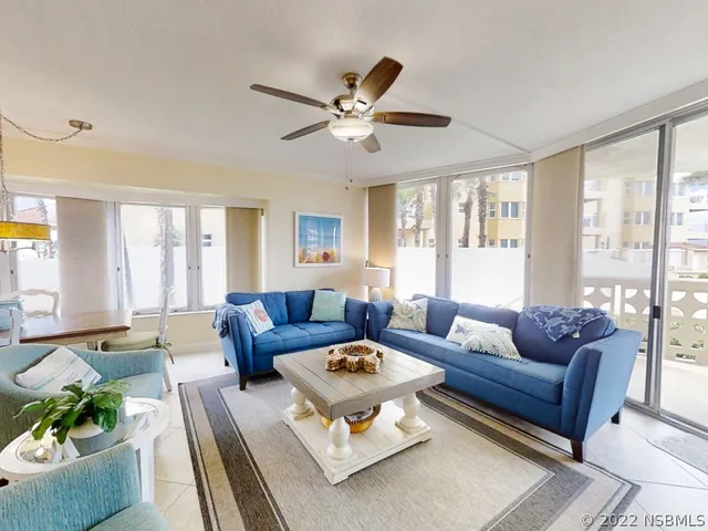 a living room with furniture and a large window