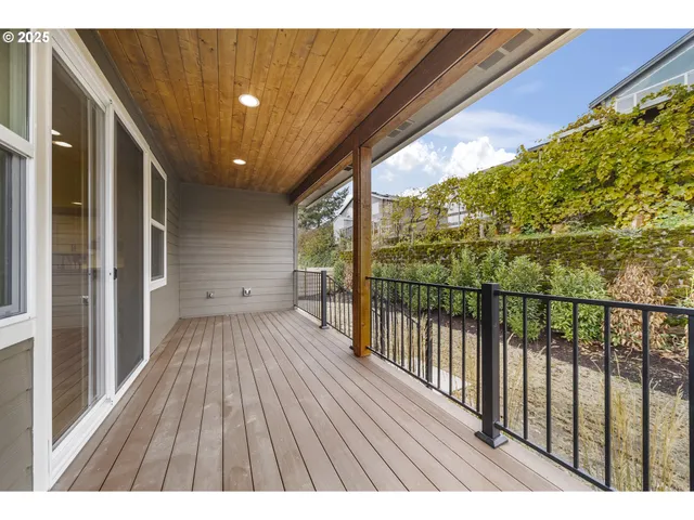 a view of balcony with wooden floor