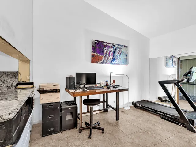 a view of a workspace with furniture