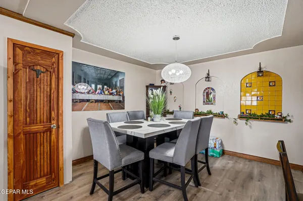 a view of a dining room that has a table and chairs
