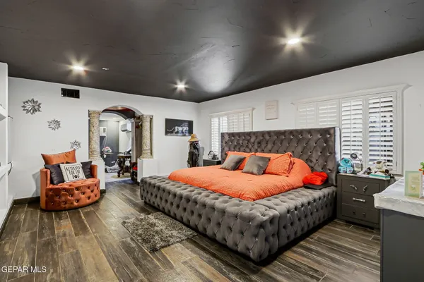 a bedroom with bed and a couch