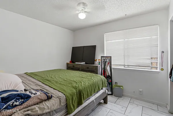 a bedroom with a bed and cabinets