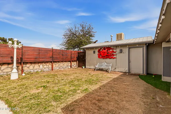 a view of a house with backyard porch and sitting area