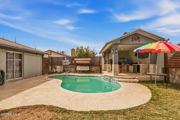 a view of a house with swimming pool