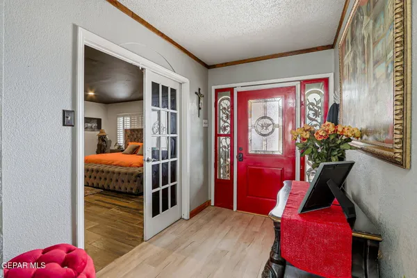 a bedroom with a bed closet and mirror