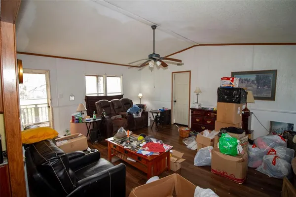 a living room with furniture fireplace and a window