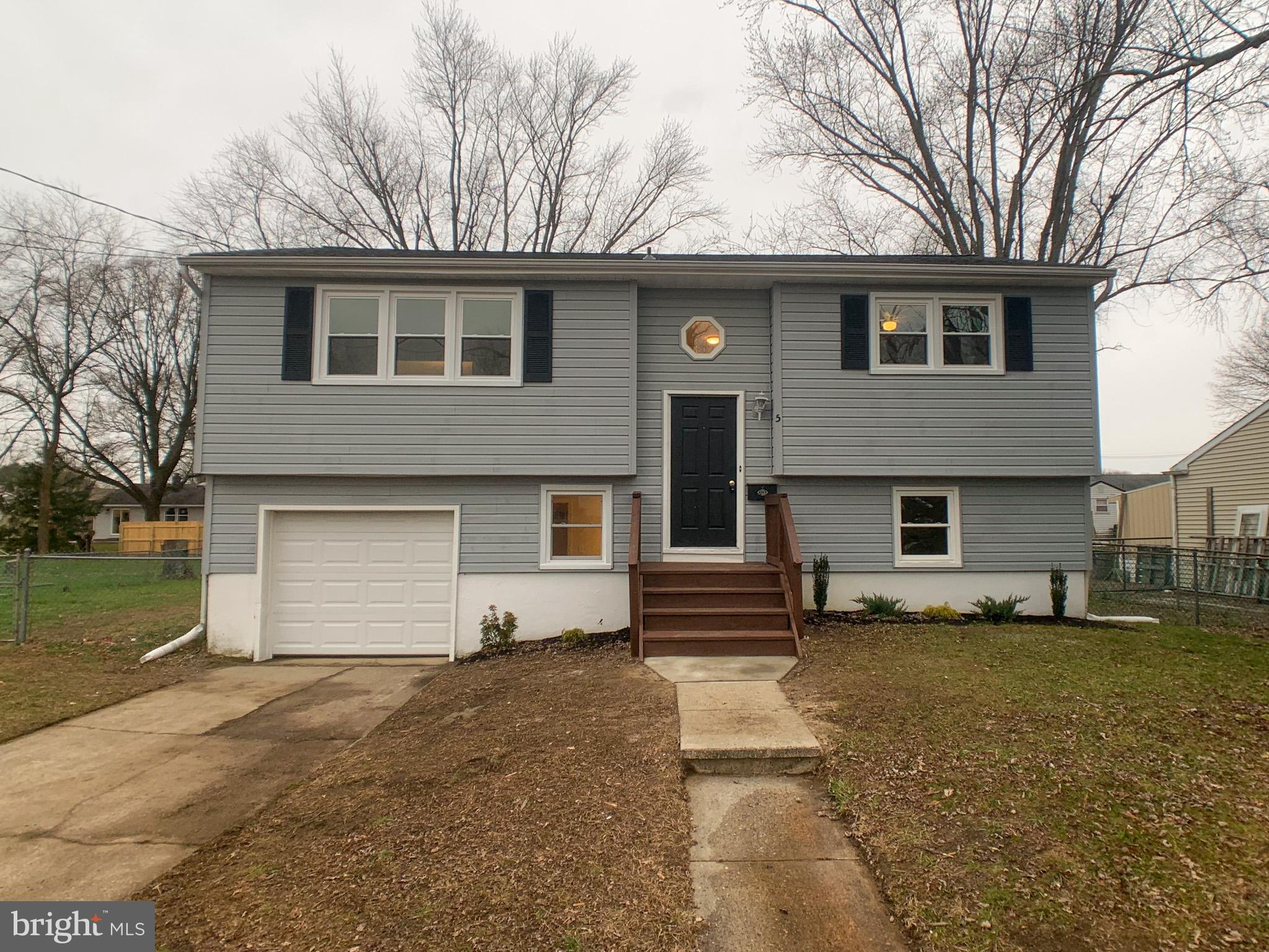 5 Estate Road Pemberton, NJ 08068 - Photo 1 of 25 a front view of a house with a yard