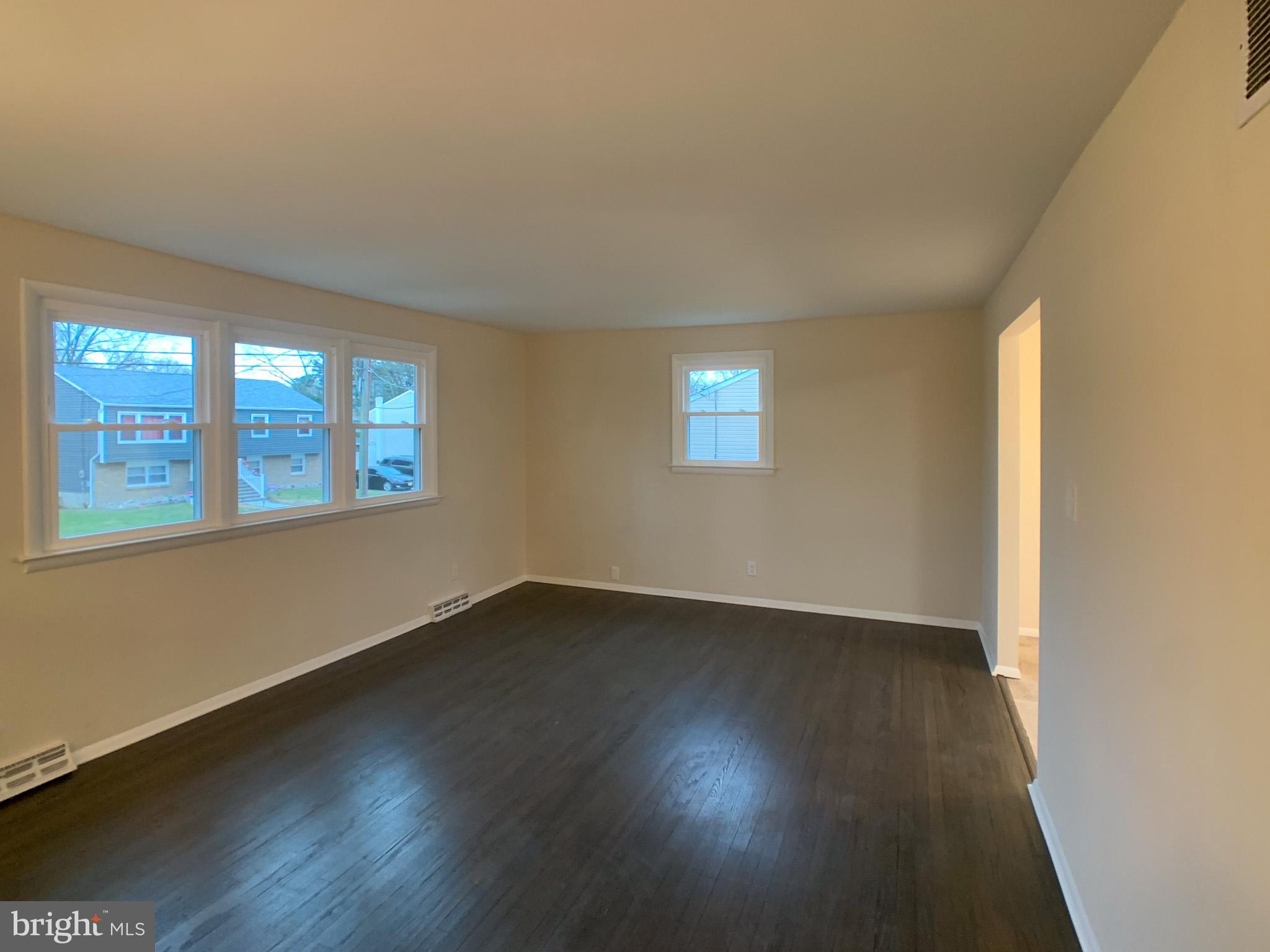5 Estate Road Pemberton, NJ 08068 - Photo 7 of 25 a view of an empty room with wooden floor and a window