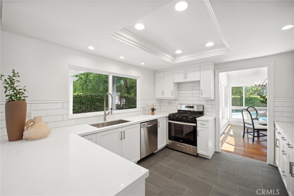 601 Calle Miguel San Clemente, CA 92672 - Photo 12 of 46 a large kitchen with stainless steel appliances granite countertop a sink and a stove