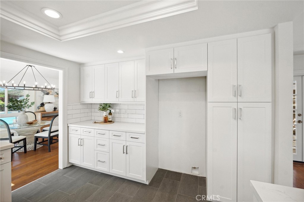 601 Calle Miguel San Clemente, CA 92672 - Photo 15 of 46 a kitchen with white cabinets and sink