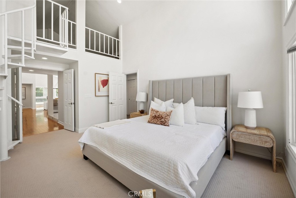 601 Calle Miguel San Clemente, CA 92672 - Photo 22 of 46 a bedroom with a bed a mirror and lamp