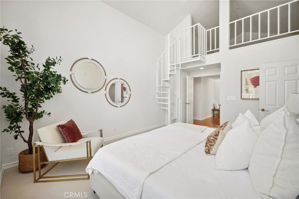 601 Calle Miguel San Clemente, CA 92672 - Photo 23 of 46 a bedroom with a bed and a chandelier