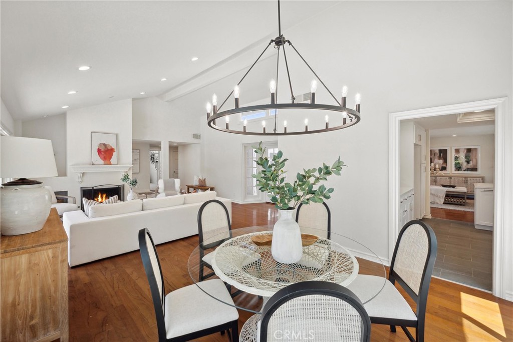 601 Calle Miguel San Clemente, CA 92672 - Photo 10 of 46 a view of a dining room with furniture a chandelier and wooden floor