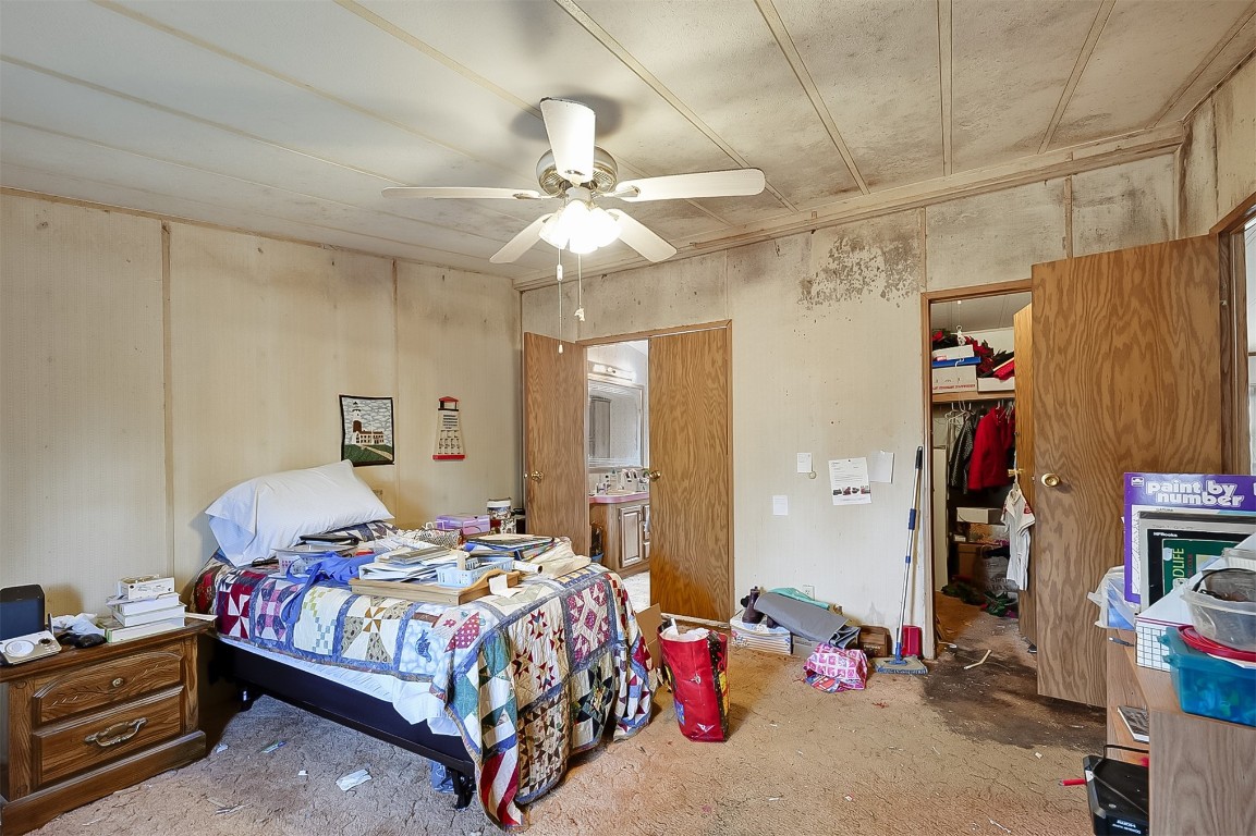 85110 Theresa Road Yulee, FL 32097 - Photo 13 of 24 a bedroom with bed and a chandelier