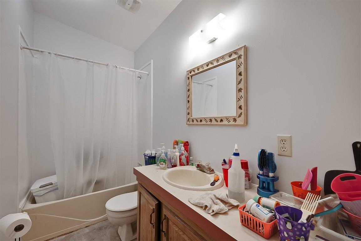 85110 Theresa Road Yulee, FL 32097 - Photo 18 of 24 a bathroom with a sink vanity mirror and toilet