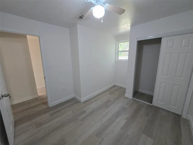 a view of balcony with wooden floor