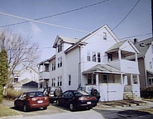 82-84 Grover Street Springfield, MA 01104 - Photo 1 of 1 a car parked in front of a white house