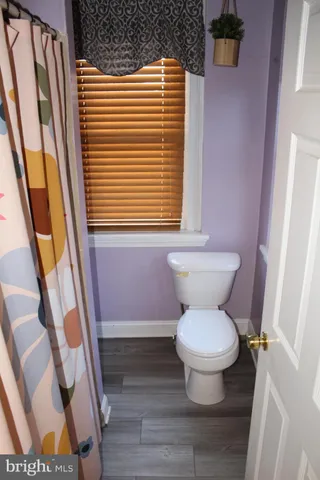 a bathroom with a toilet and a sink